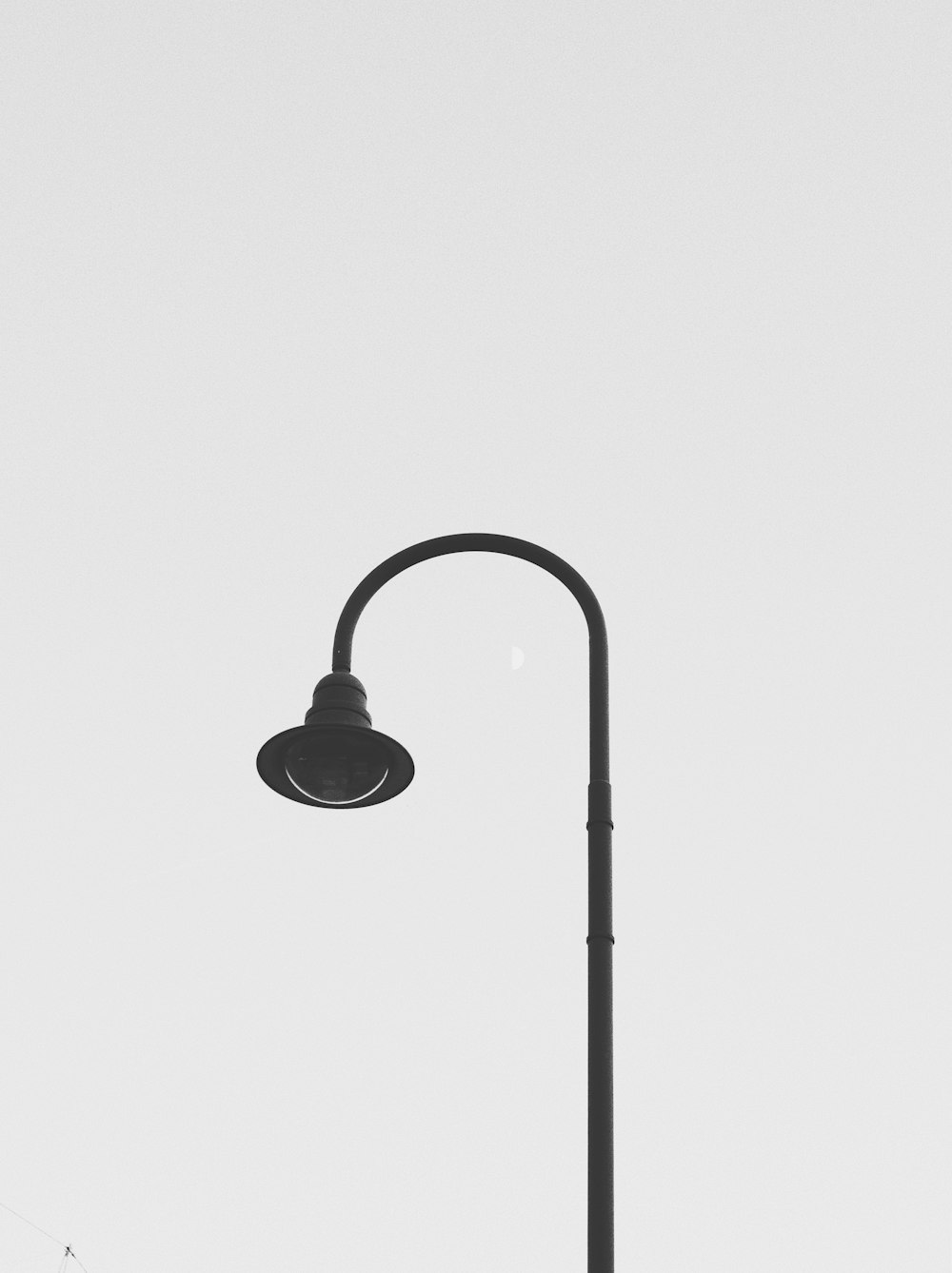 black steel lamp post with white background
