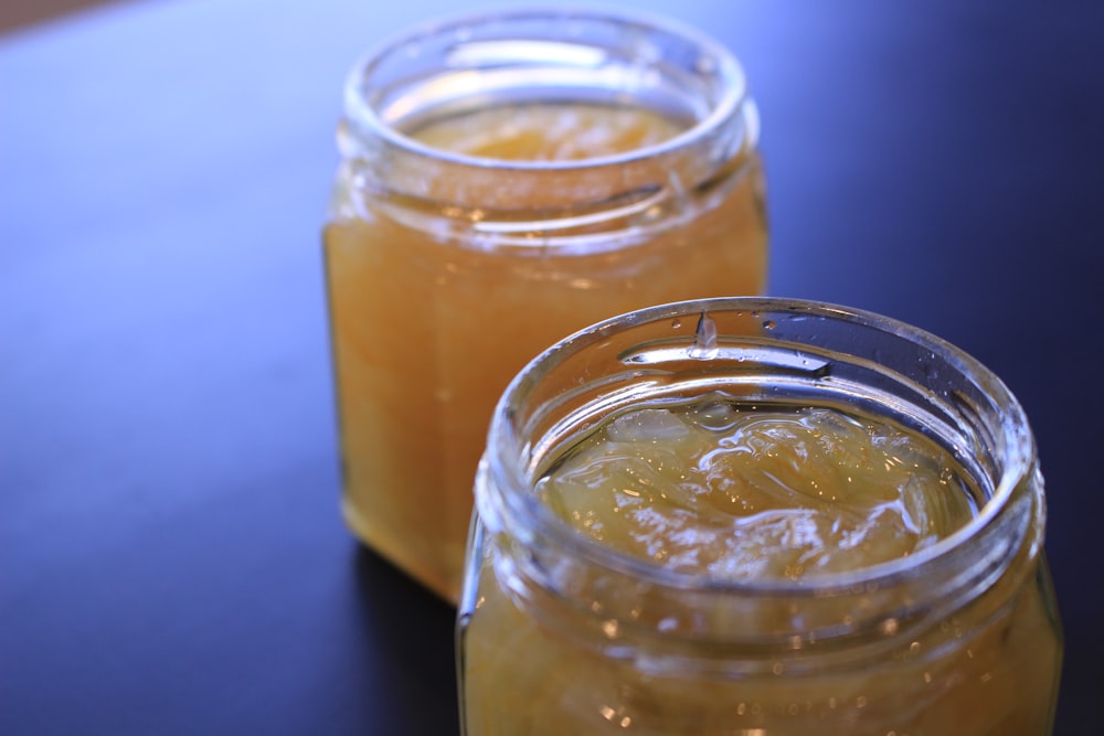 clear glass jar with yellow liquid