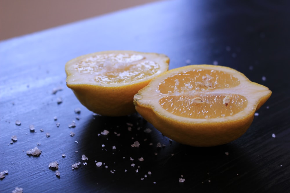 sliced lemon on black table