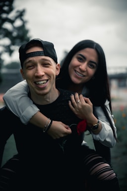 photography poses for couples,how to photograph man in black long sleeve shirt smiling beside woman in white long sleeve shirt