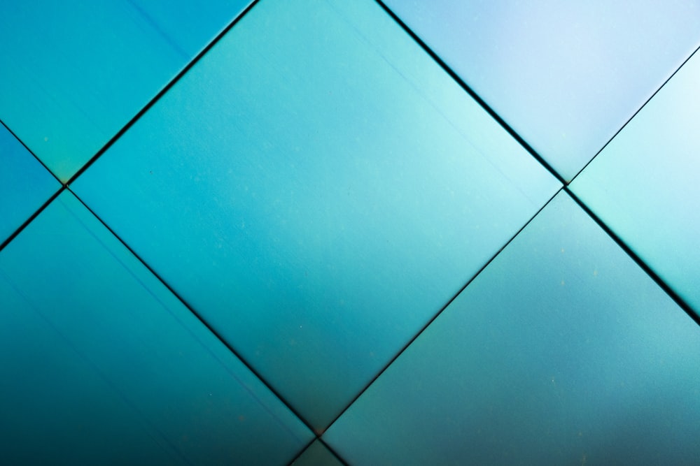 blue ceramic tile flooring in close up photography