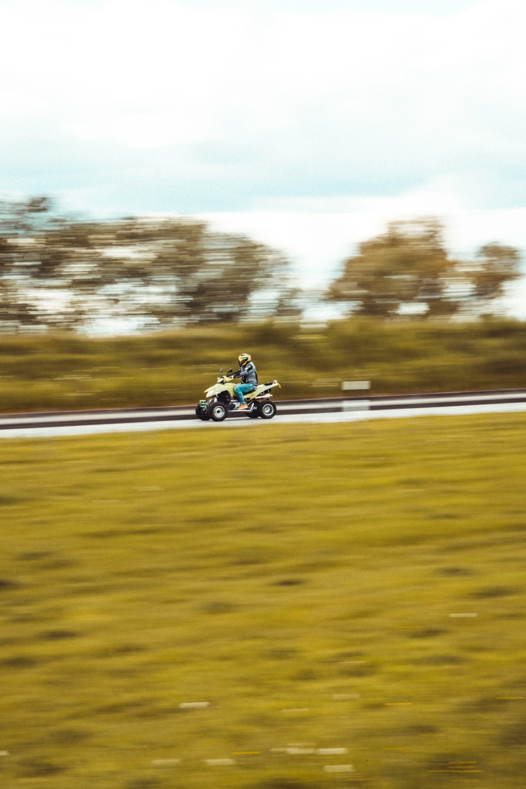 man riding on yellow and black sports bike on road during daytime