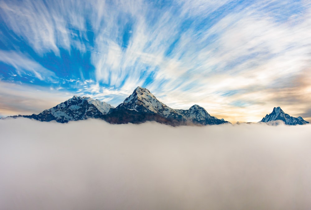 snow covered mountain under blue sky during daytime