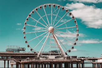 a ferris wheel sitting on top of a pier