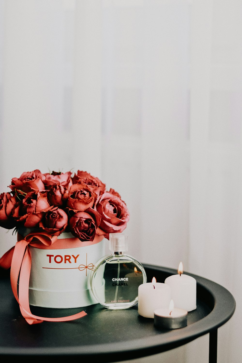 pink roses in clear glass jar