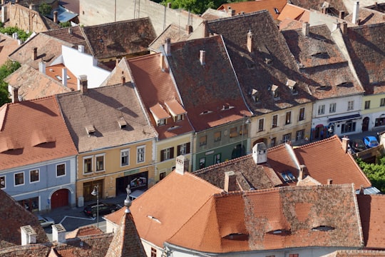 brown and white concrete houses during daytime in Sibiu Romania