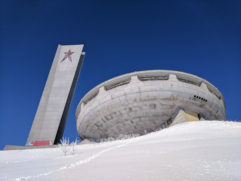 white and red airplane on white snow covered ground during daytime