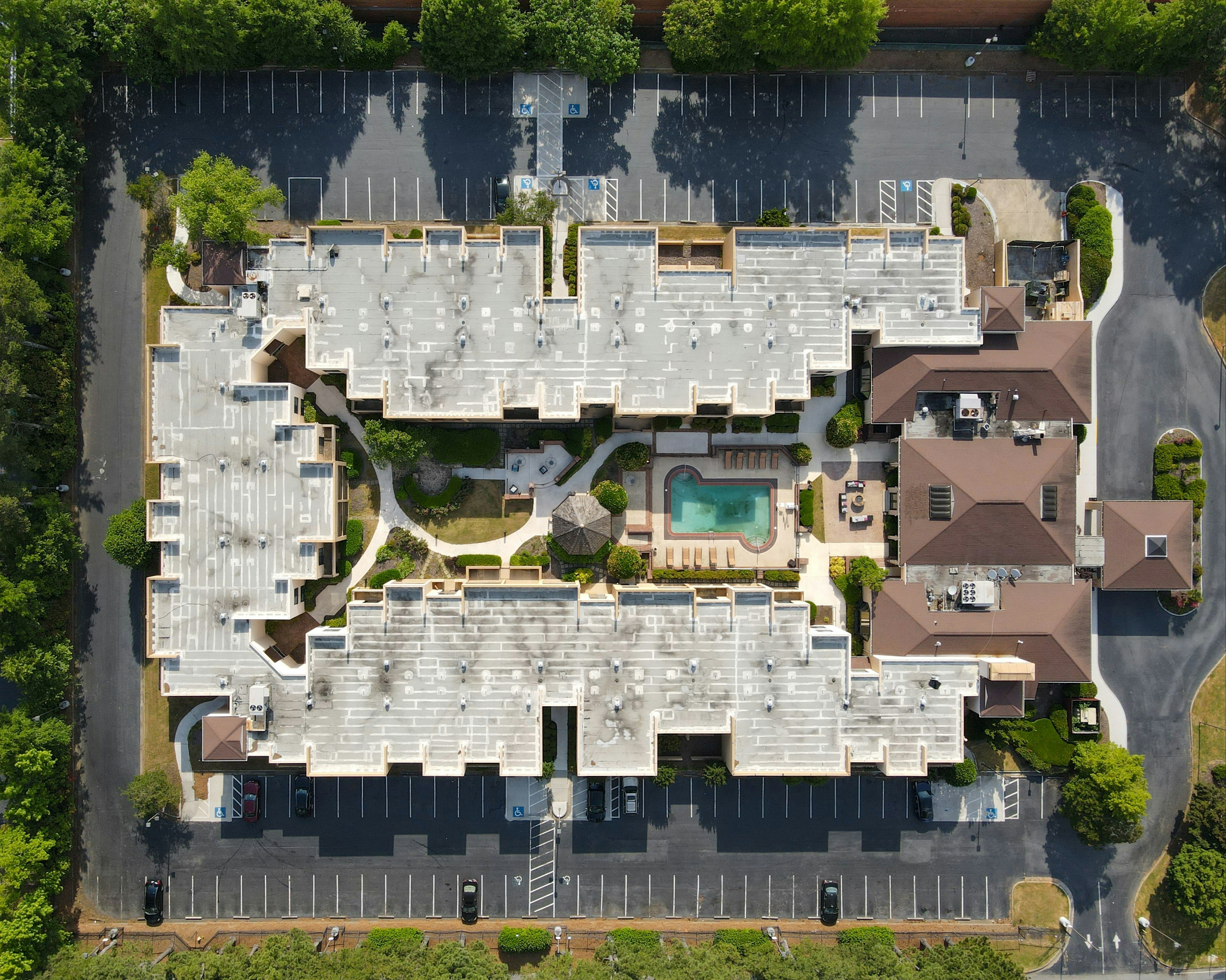 white and brown concrete building, Aerial View of the Courtyard Mariott Hotel in Tucker, GA