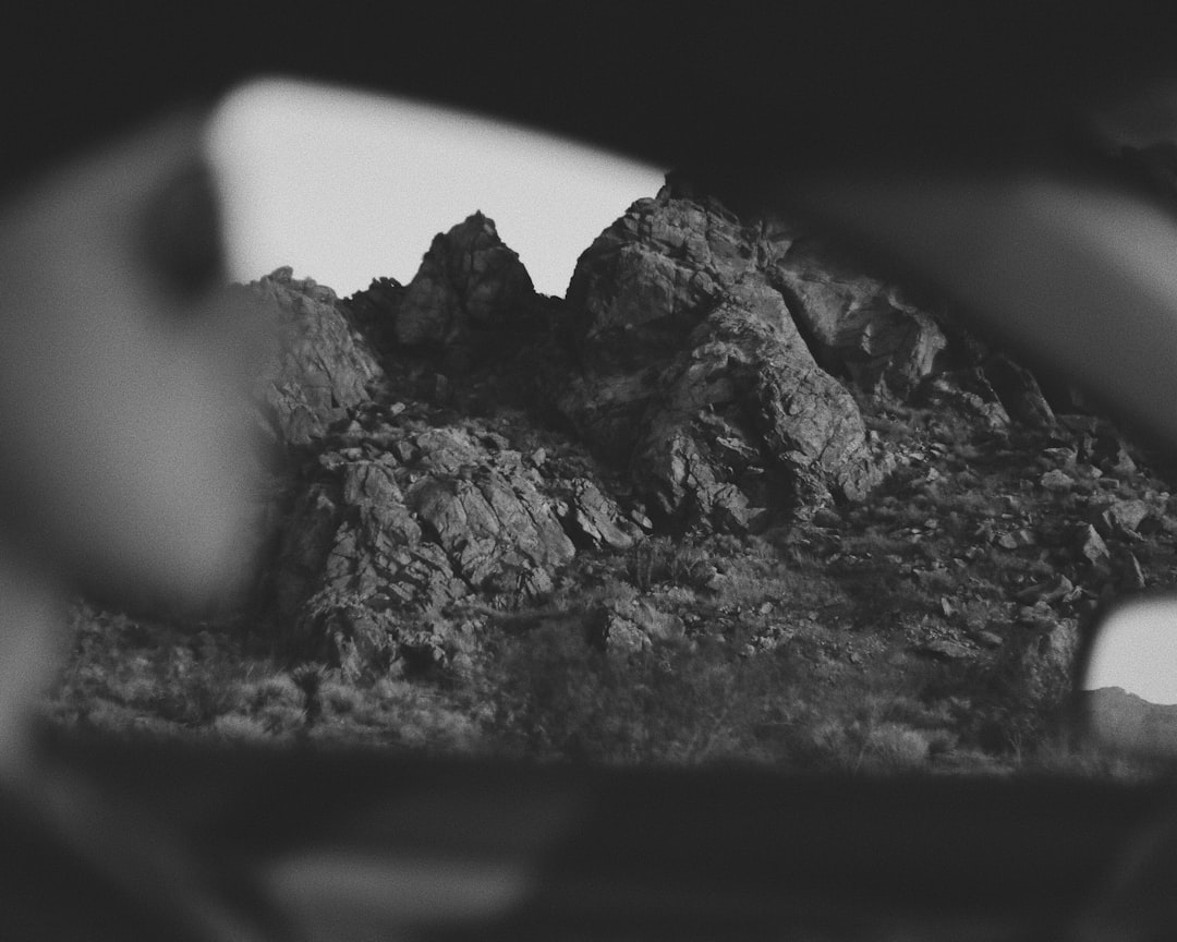 grayscale photo of rock formation