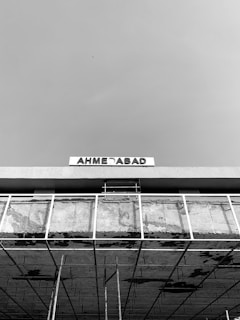 a black and white photo of a building under construction