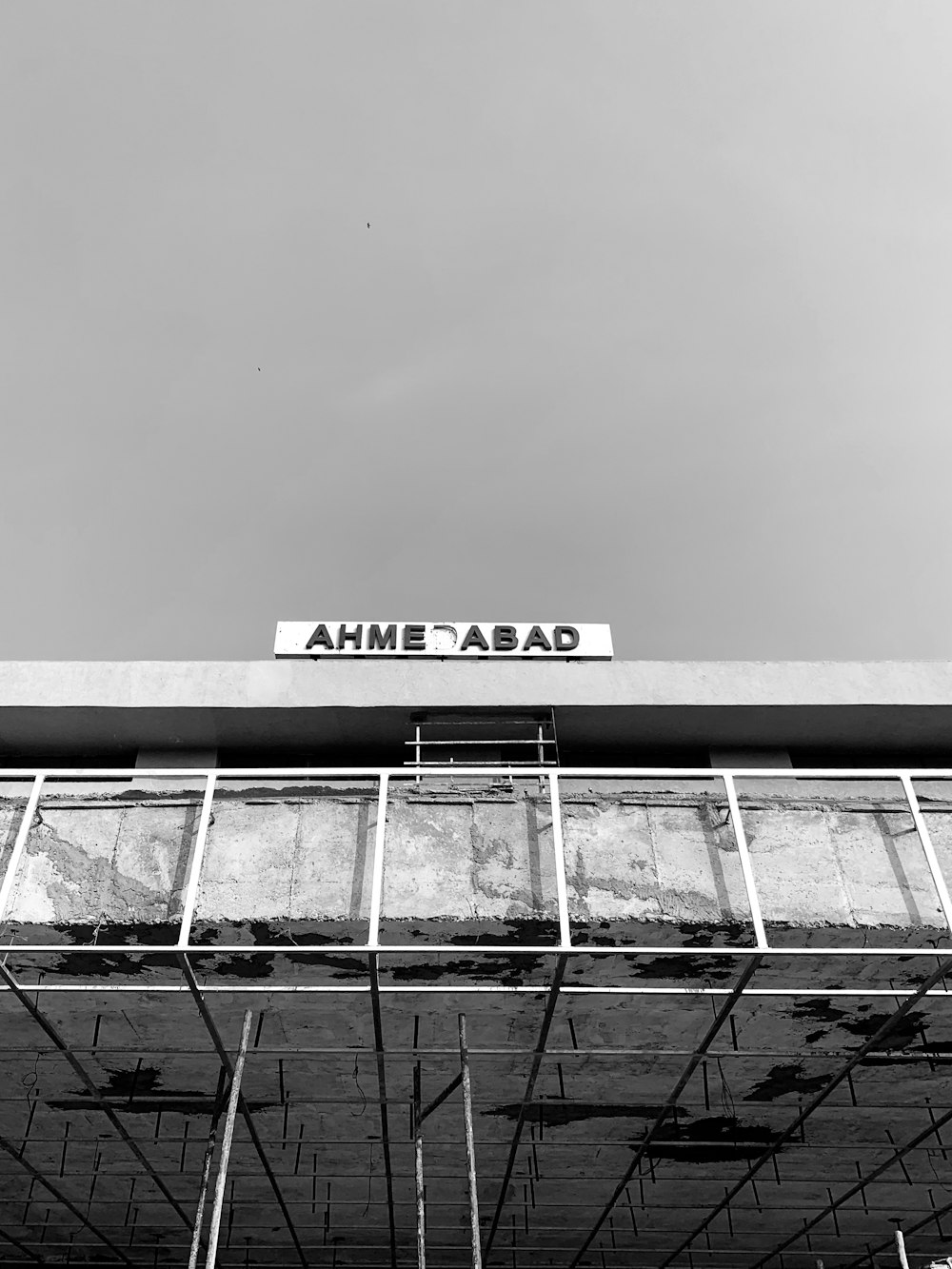 a black and white photo of a building under construction