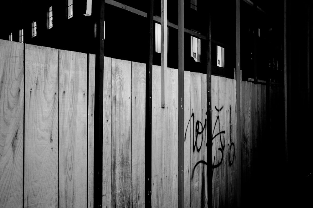 grayscale photo of wooden wall