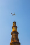 white airplane flying in the sky during daytime