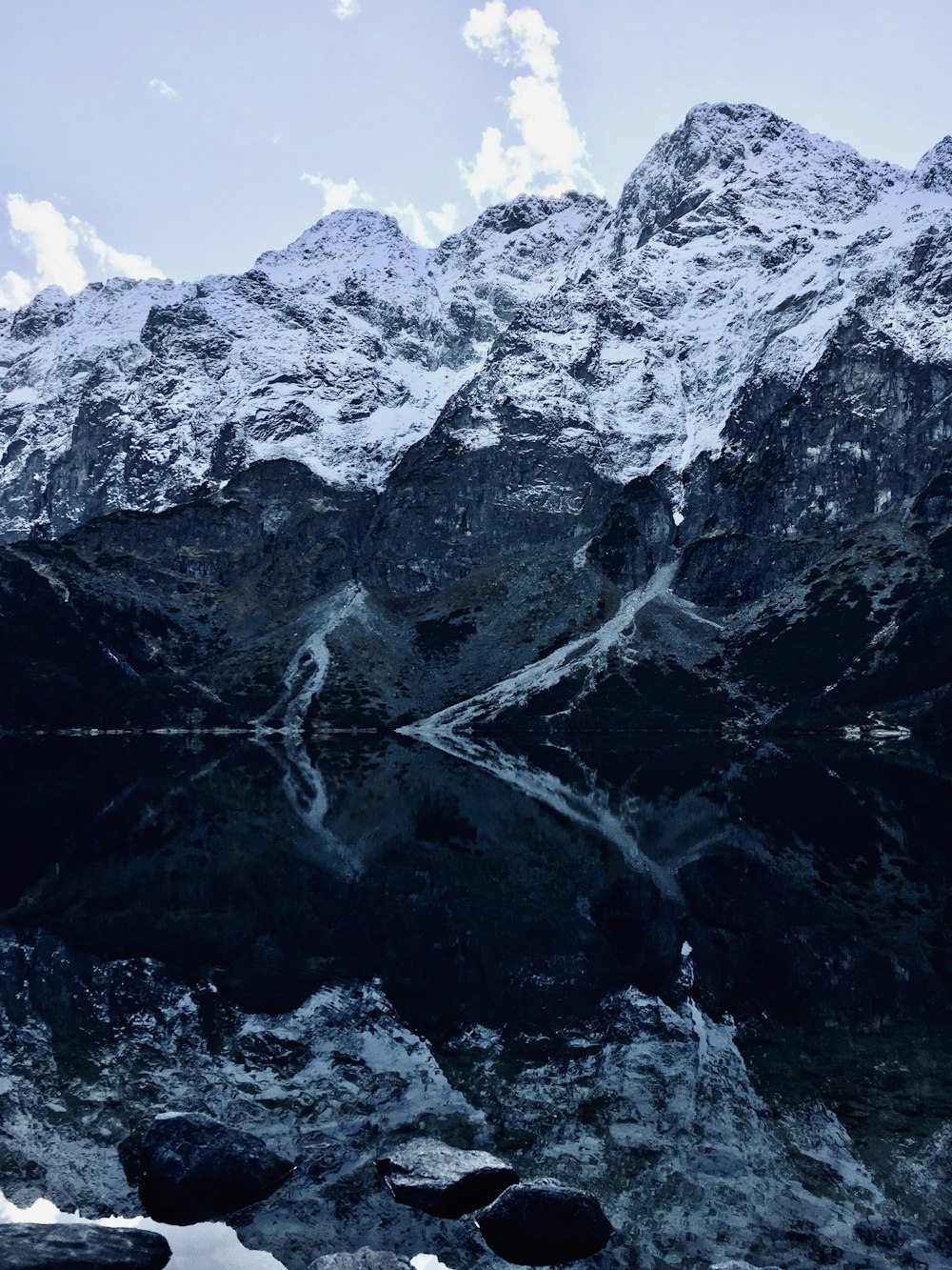 black and white mountain under blue sky during daytime