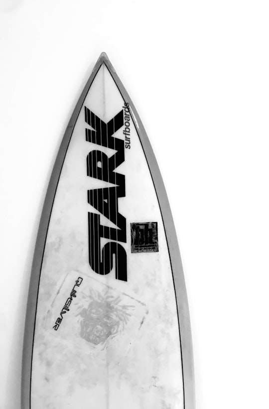 grayscale photo of a surfboard in Longeville-sur-Mer France