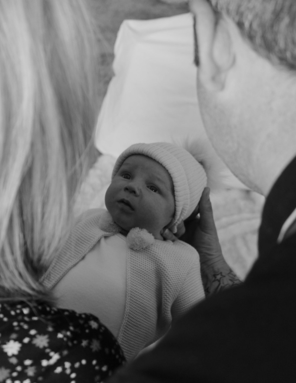 grayscale photo of woman carrying baby