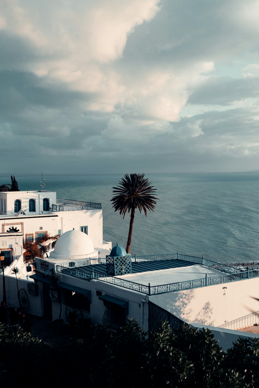 white and gray ship on sea under cloudy sky during daytime