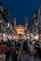people walking on street during night time