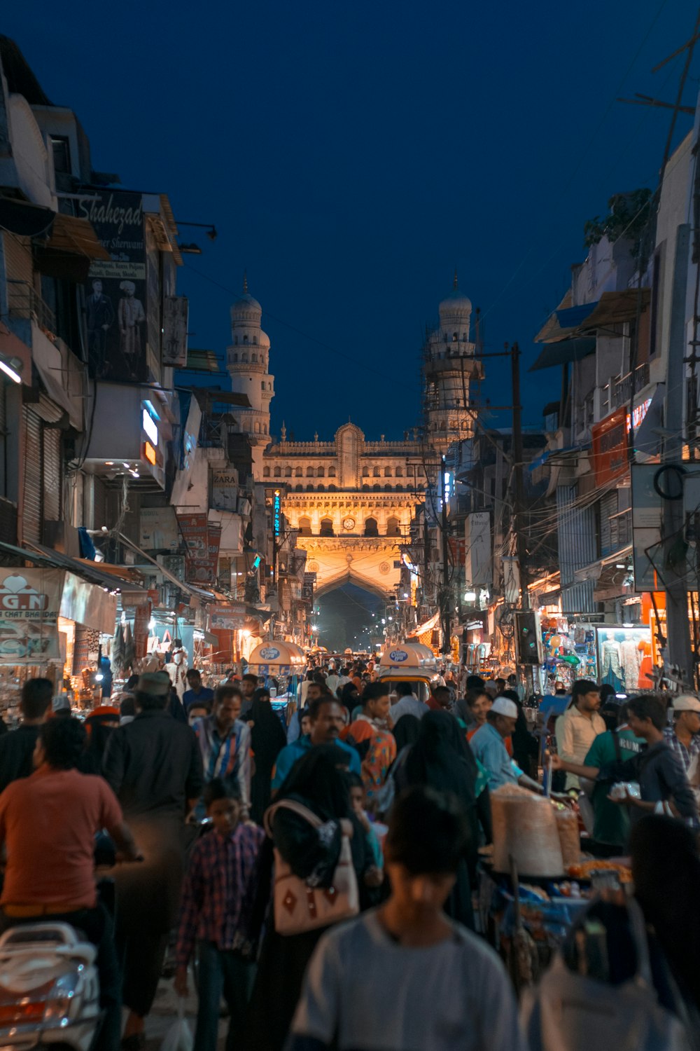 people walking on street during night time