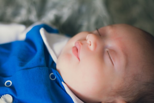 child in blue and white collared shirt