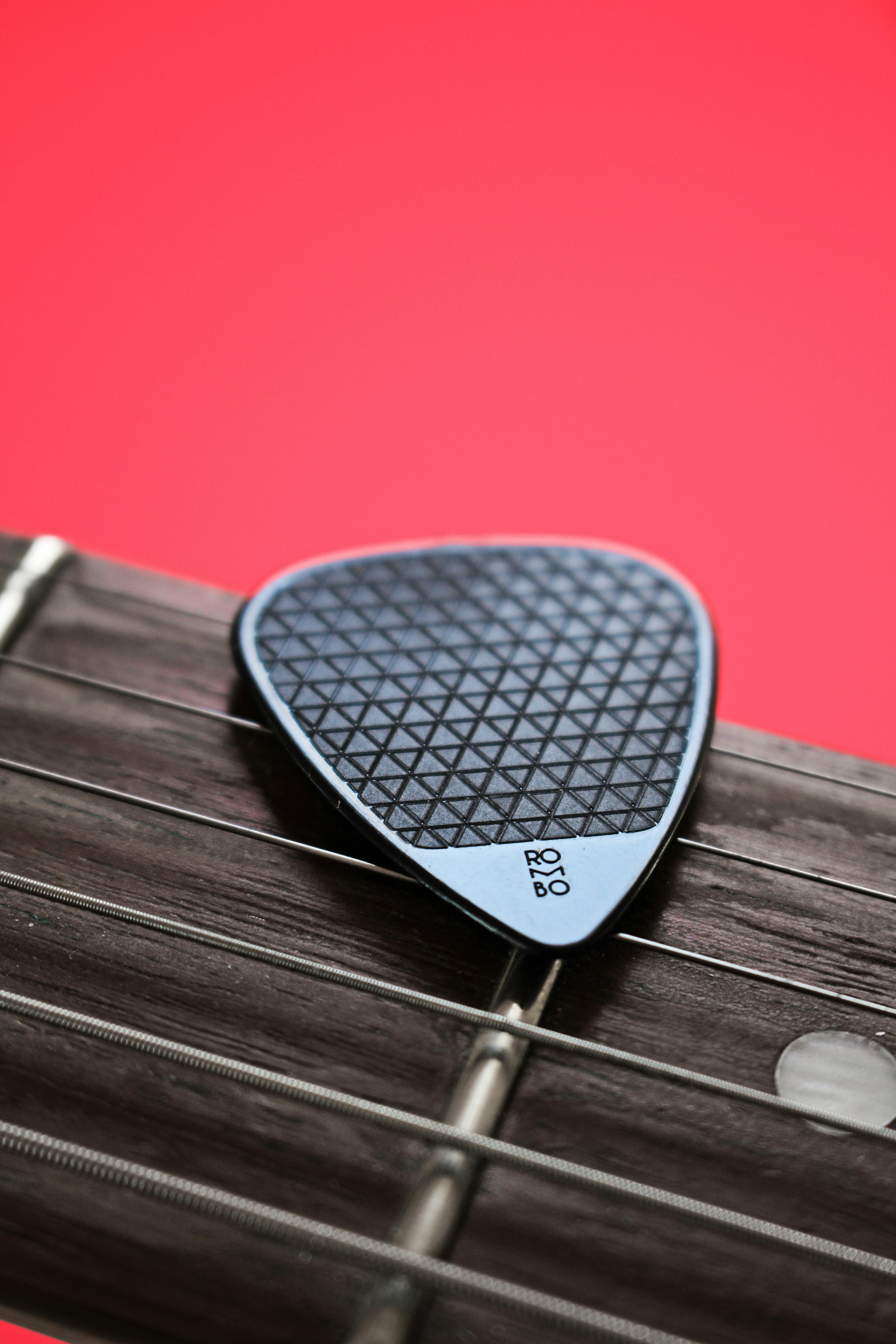 Black and white guitar pick photo Free Pink Image on Unsplash