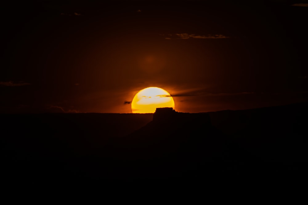 silhouette of mountain during sunset