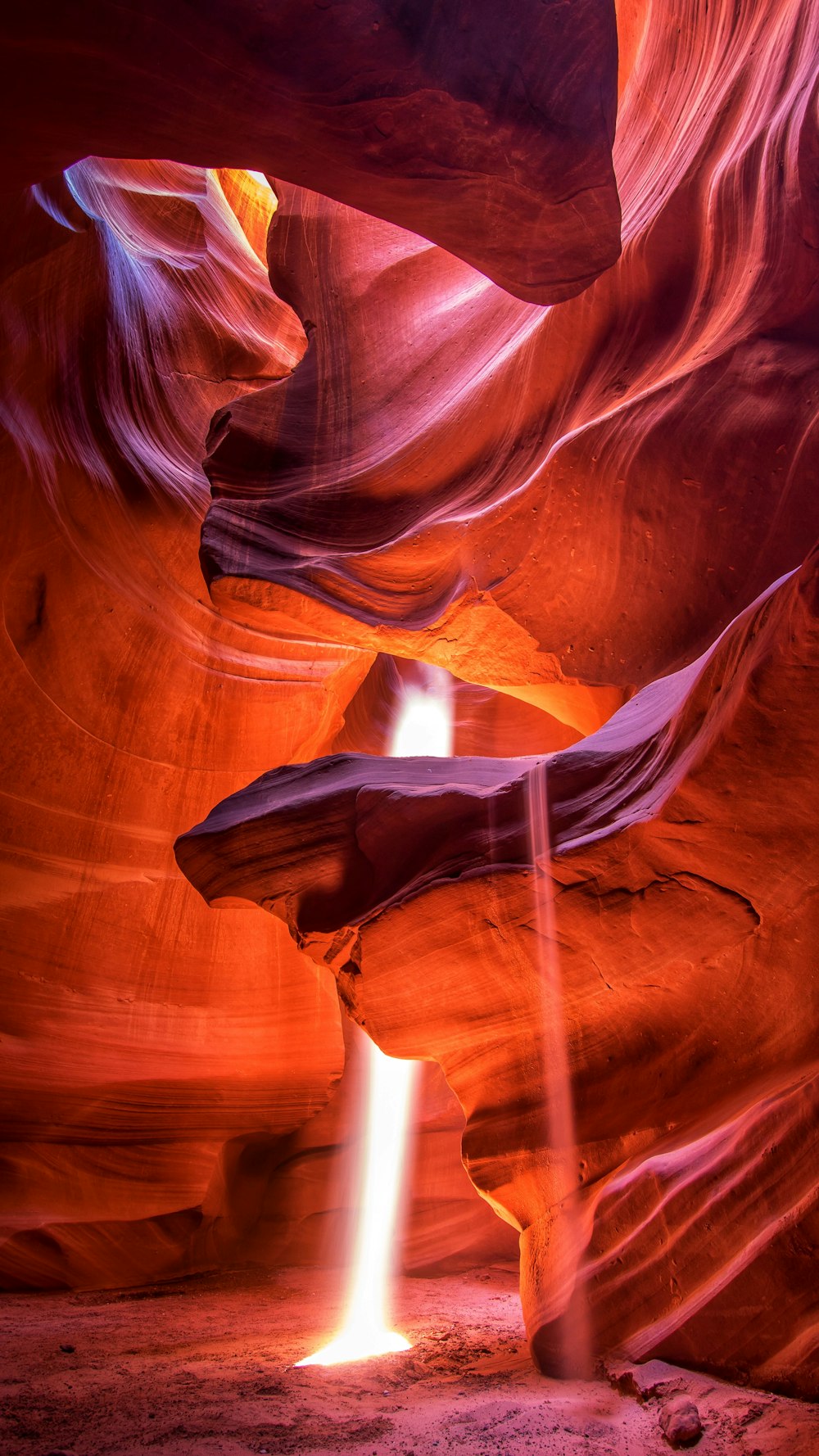 brown and white cave with light