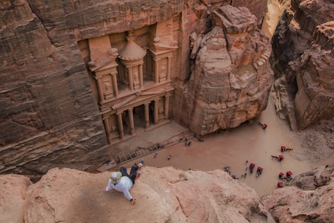 people walking on brown rocky mountain during daytime