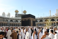 people standing in front of white concrete building during daytime