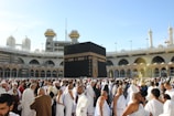 people standing in front of white concrete building during daytime
