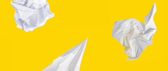 white paper on yellow background