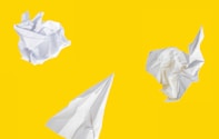 white paper on yellow background
