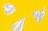 white paper on yellow background