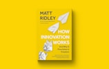 A yellow book cover with the title 'How Innovation Works' by Matt Ridley, featuring paper airplanes and crumpled paper graphics.