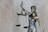woman holding sword statue during daytime