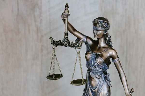 Lady Justice background.by Tingey Injury Law Firm