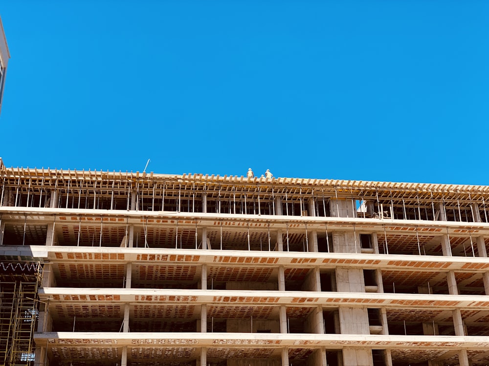 brown concrete building under blue sky during daytime