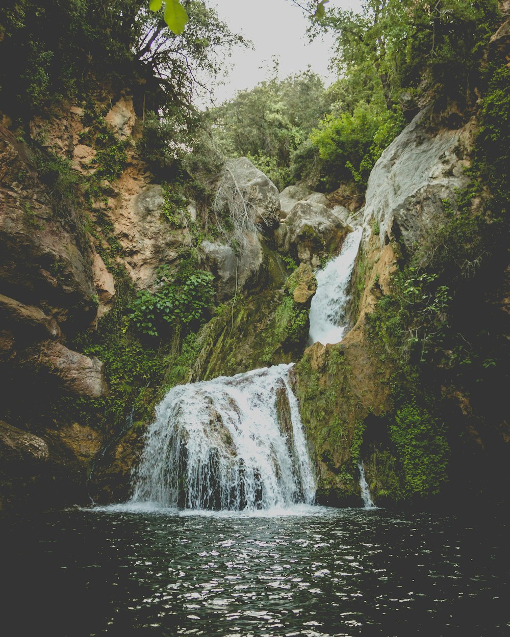 waterfalls in the middle of the forest