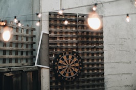 black and white analog clock at 11 00