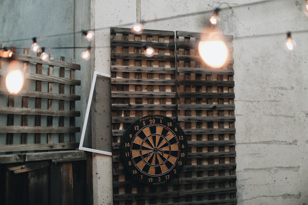 black and white analog clock at 11 00