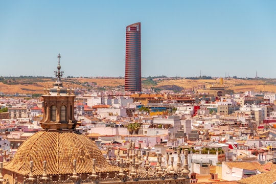 brown concrete building under blue sky during daytime in Sevilla Spain