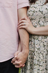 a hand holding a baby