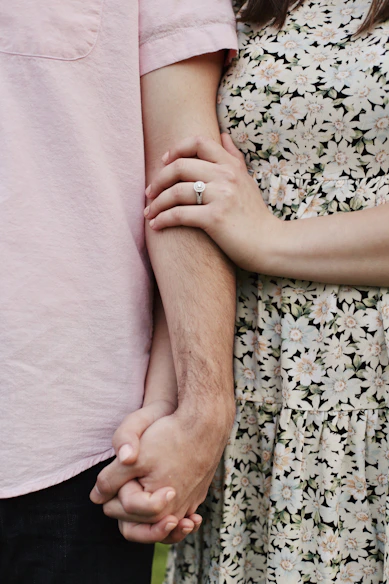 a hand holding a baby