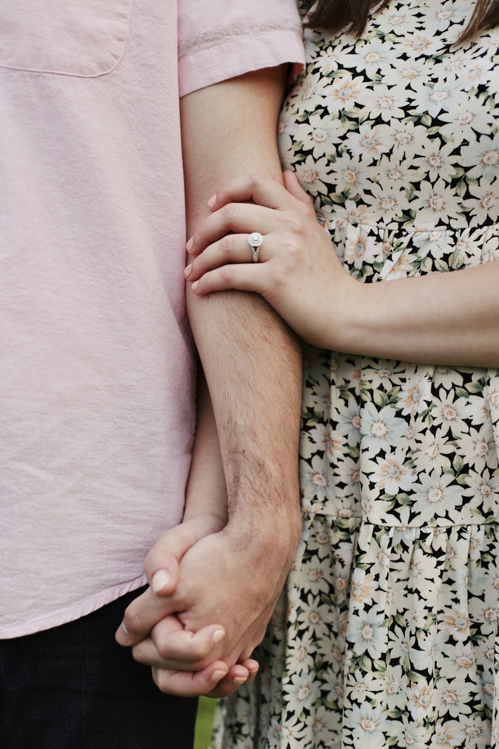 a hand holding a baby