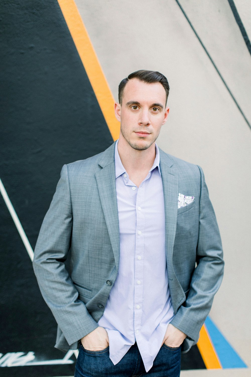 man in gray suit jacket standing