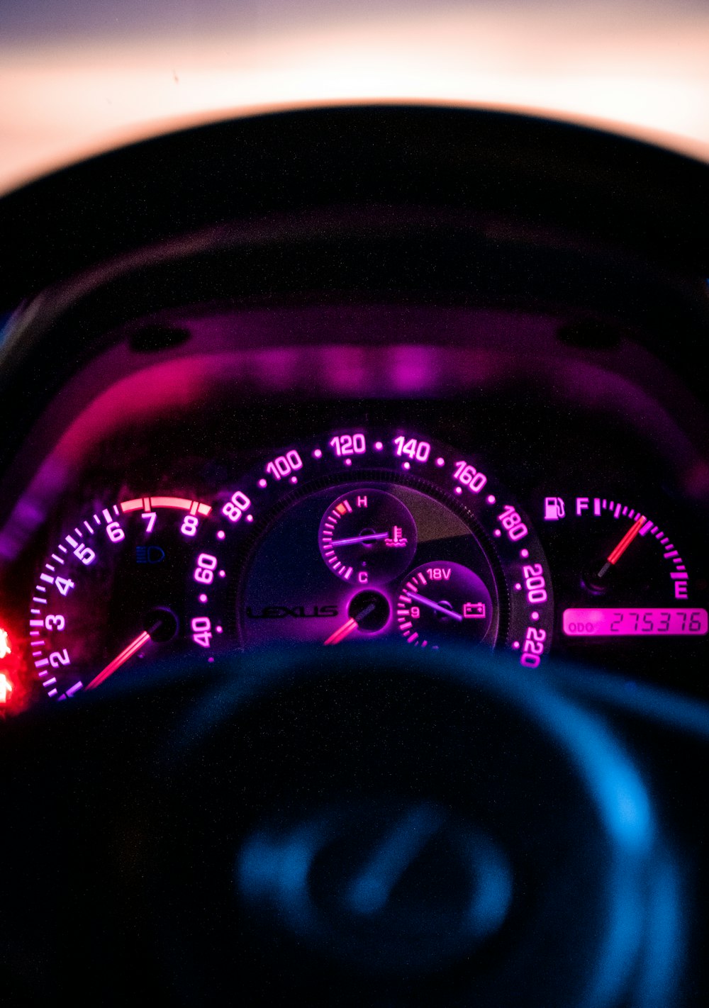black and red analog speedometer