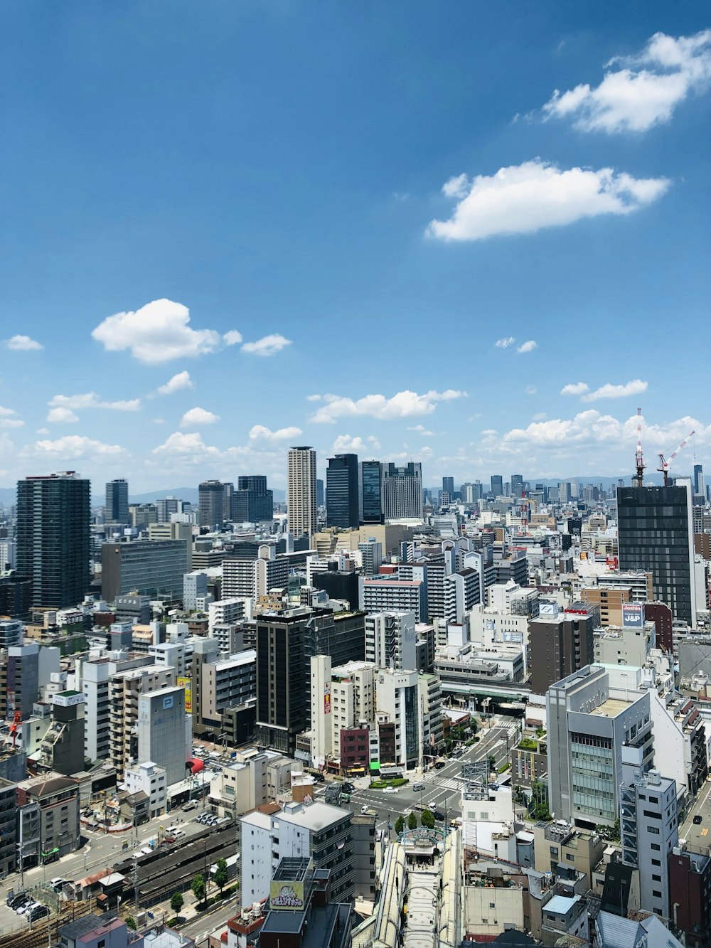 city buildings under blue sky during daytime