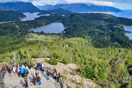 people hiking on mountain during daytime in San Carlos de Bariloche Argentina