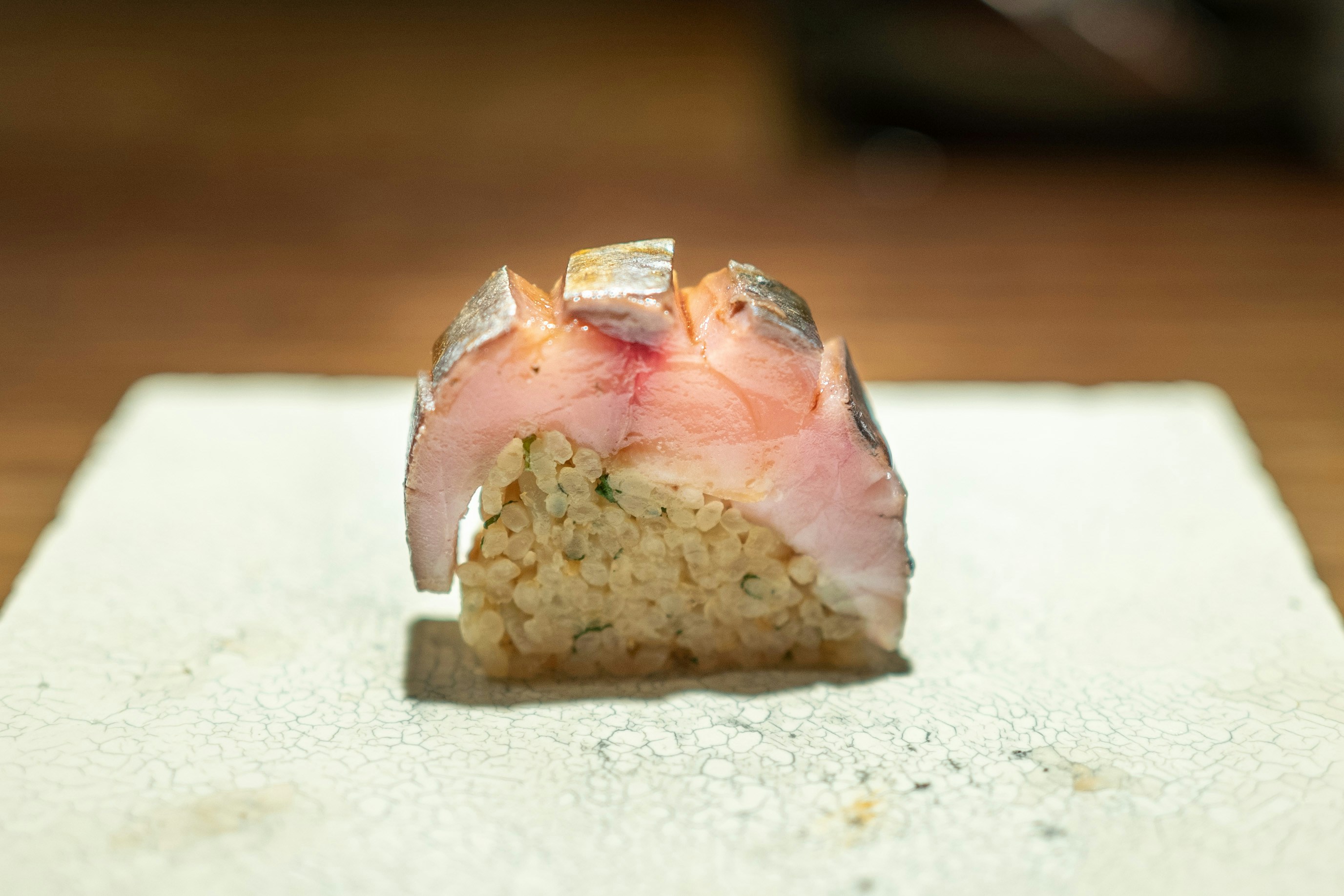 pink and white stone on white textile