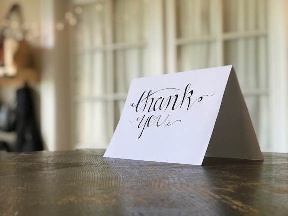 A close-up of a handwritten note expressing gratitude.